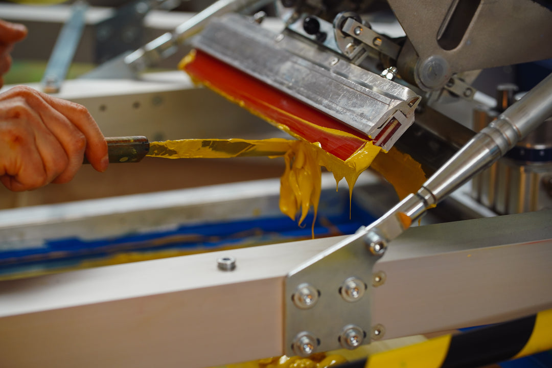 scooping screen printing ink on to a screen by hand